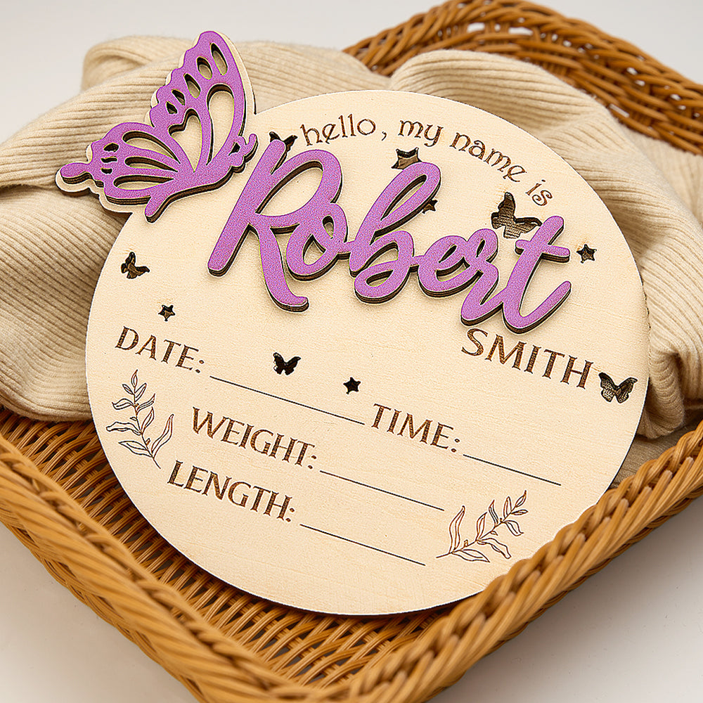 Styled nursery shot with a personalised butterfly birth announcement sign on a shelf as a charming baby shower keepsake and room decoration