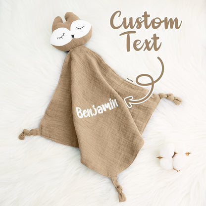 Close-up of towel corner and personalised embroidery, showing care-friendly cotton fabric and fine finishes — keepsake comforter for babies