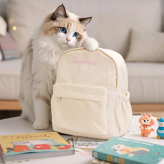 Front view of personalised name embroidery rabbit ear backpack in durable Oxford fabric, a custom kids school bag with secure zip, embroidered name and adjustable straps