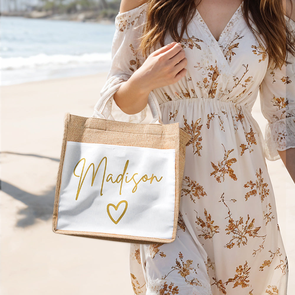 Personalised jute tote bag with pocket holding phone and keys — practical travel and beach accessory for her