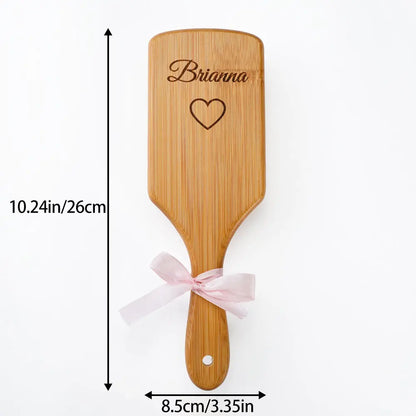 Close-up of laser engraved name on bamboo hairbrush – bespoke custom engraving for wedding gifts and thank-you presents