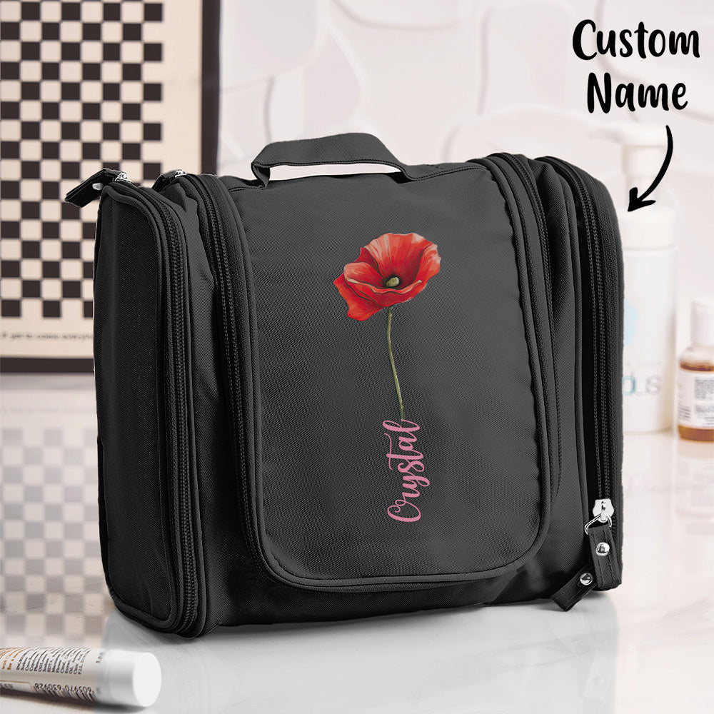Birth flower toiletry bag hung open to reveal spacious interior, zipped compartments and organiser pockets — travel waterproof makeup organiser