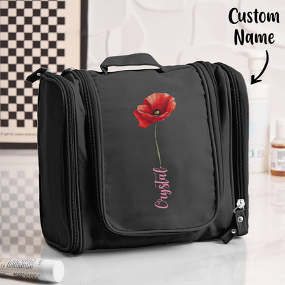 Birth flower toiletry bag hung open to reveal spacious interior, zipped compartments and organiser pockets — travel waterproof makeup organiser