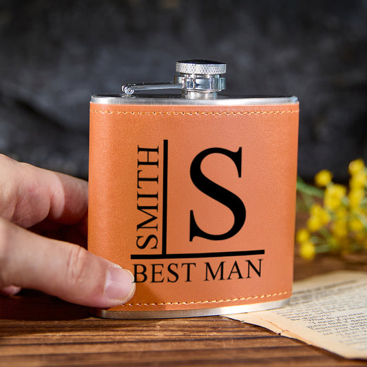 Front view of personalised name 6oz stainless steel whisky flask with brown PU leather wrap and engraved name - premium personalised gift for him