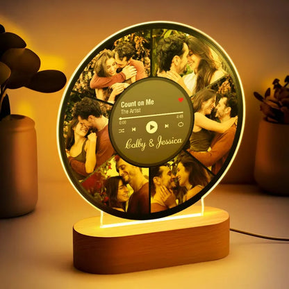 Close up of personalised LED photo lamp lit with warm ambient light showing etched photos on premium acrylic — custom photo collage night light, ideal gifts for couple