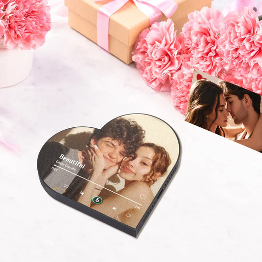 FridgeBeats personalised music fridge magnet in heart-frame album design showing a customised photo and play controls — personalised MP3-playing fridge magnet gift for couples