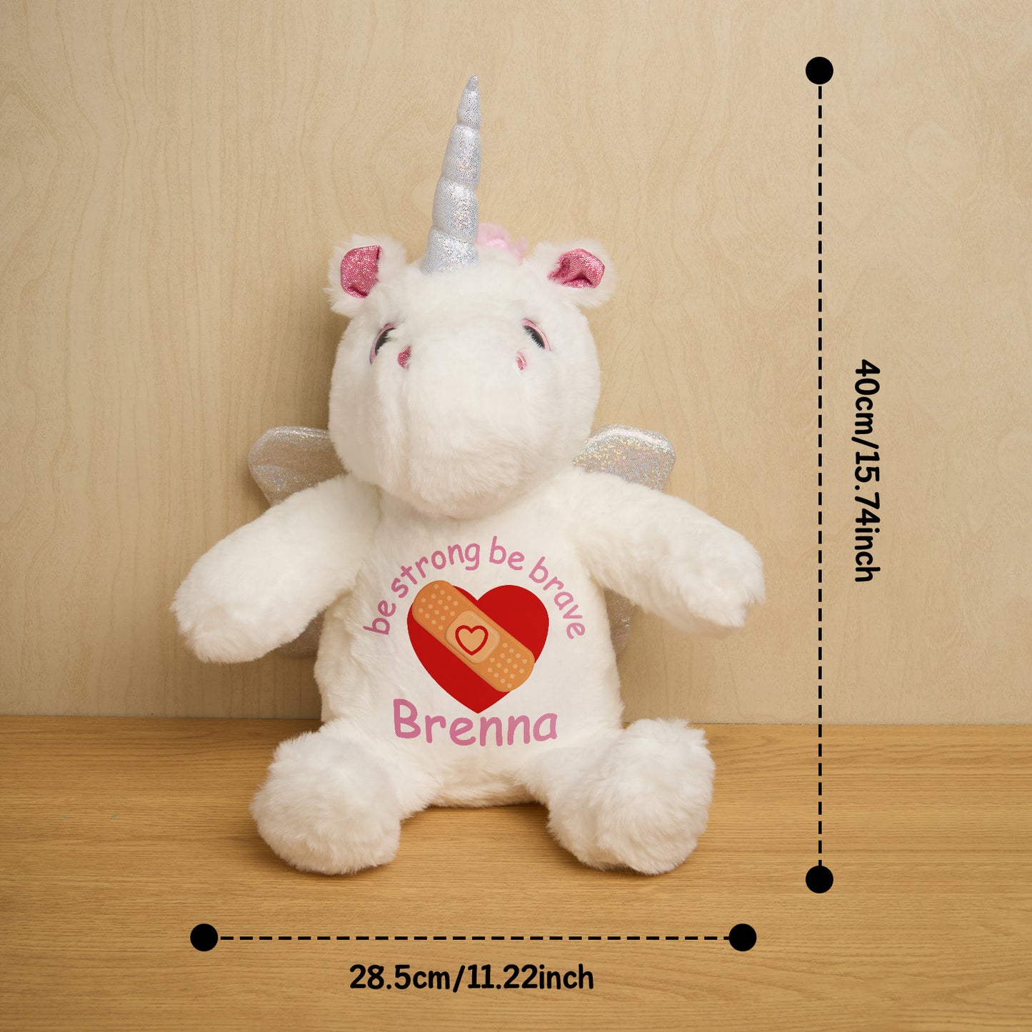 Rear view of personalised unicorn birth announcement teddy displaying customised text on the belly, a thoughtful baby gift