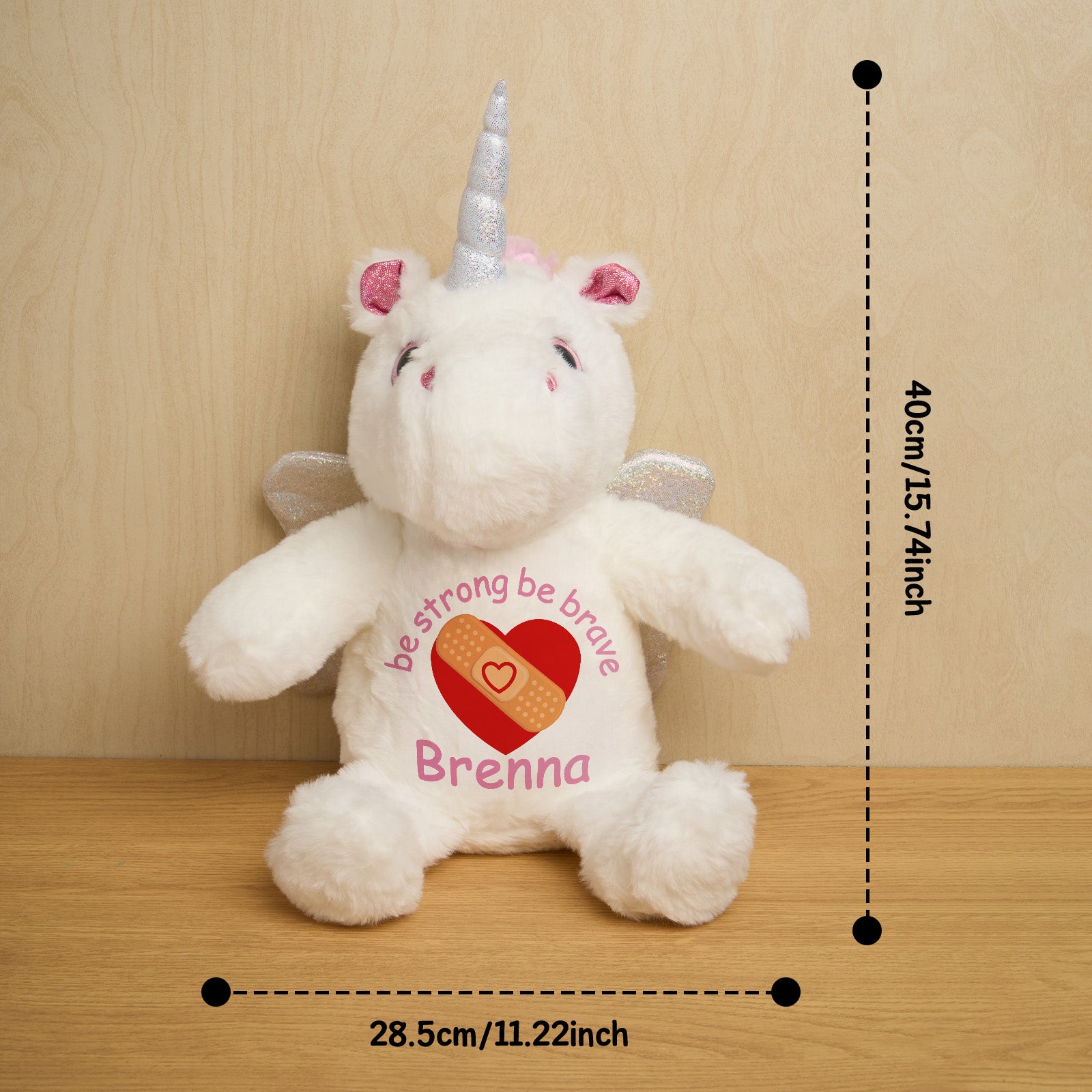 Rear view of personalised unicorn birth announcement teddy displaying customised text on the belly, a thoughtful baby gift