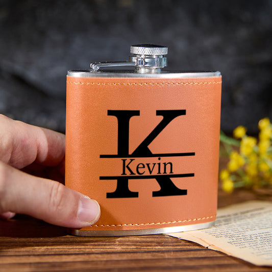 Personalised leather-wrapped 6oz (180ml) stainless steel whisky flask with engraved initials and stitched PU leather finish, front product shot — engraved gift for him