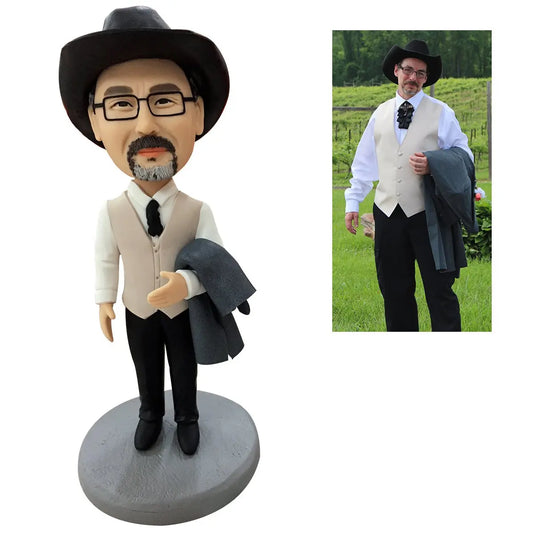Personalised polymer clay mini‑me bobblehead — custom head sculpted from your photo on an engraved base, front view, ideal personalised gift