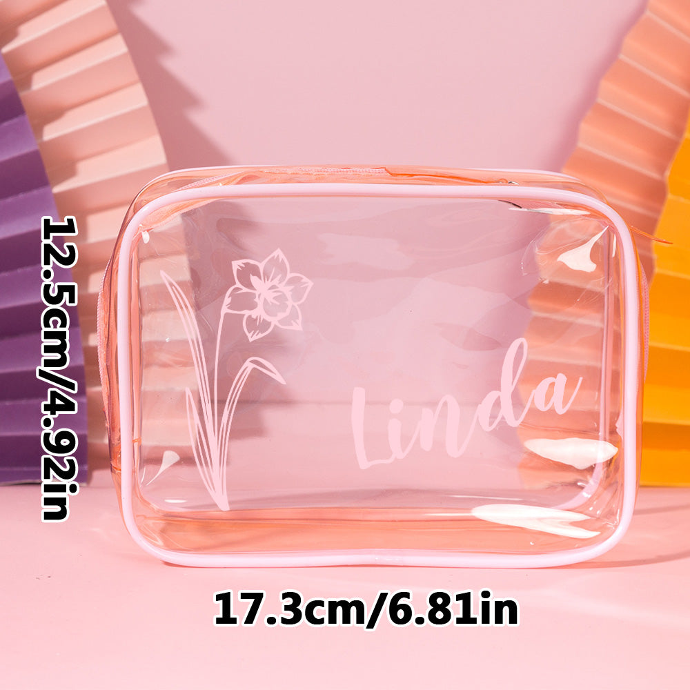 Close-up of personalised birth flower artwork and name on clear PVC makeup bag – waterproof personalised cosmetic pouch