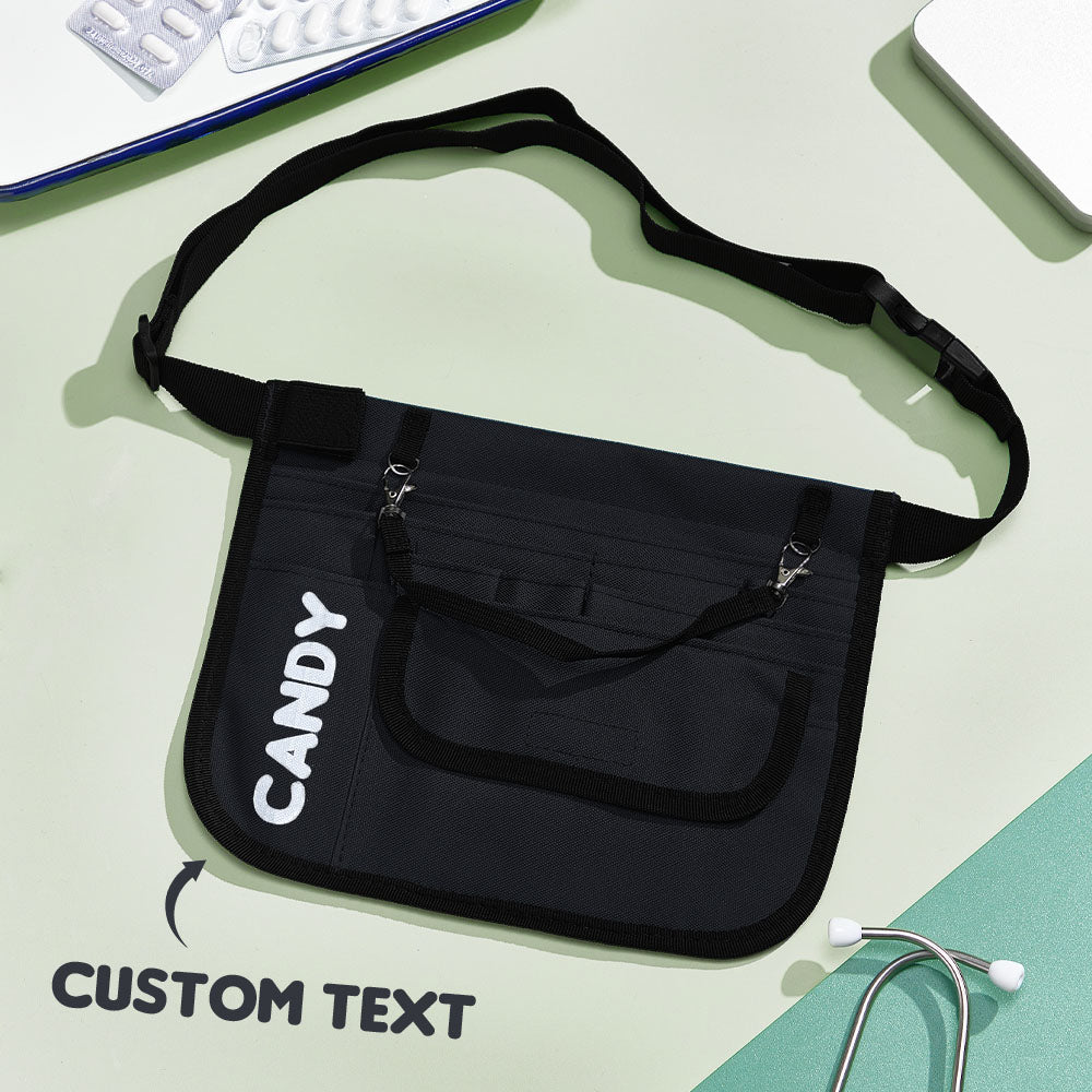 Close-up of organised compartments inside nurse organiser bag with pens, scissors and stethoscope — personalised medical waist bag