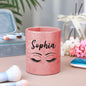 Personalised glitter leather brush cup holding a selection of makeup brushes, illustrating organised vanity storage and easy-to-use design