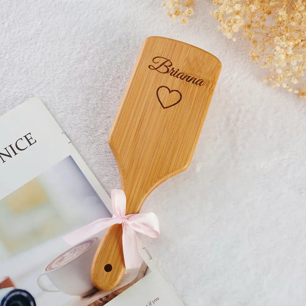 Bamboo hairbrush on a dressing table with engraved name – personalised thank-you gift that gently detangles for smooth, tangle-free hair