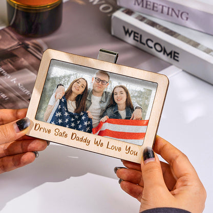 Frame shown attached to a fridge surface using the magnetic backing.