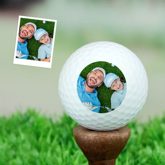 Close-up of a personalised photo golf ball featuring a family picture and 'Best Dad Ever' text — perfect custom photo golf ball Father's Day gift for dad