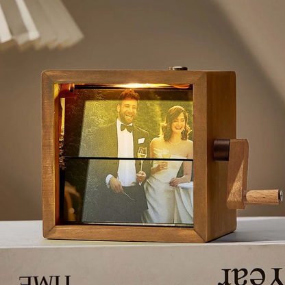 Detailed view of the photo strip animation inside a hand-cranked flipbook frame showing smooth flipping photos — bespoke keepsake