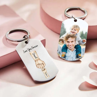 Close-up of engraved-look stainless steel keyring detail with personalised names and family fist design – keepsake for Dad