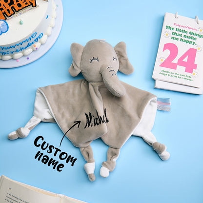 Personalised baby comforter with embroidered name and a soft rabbit head, 25cm square, made from gentle polyester.