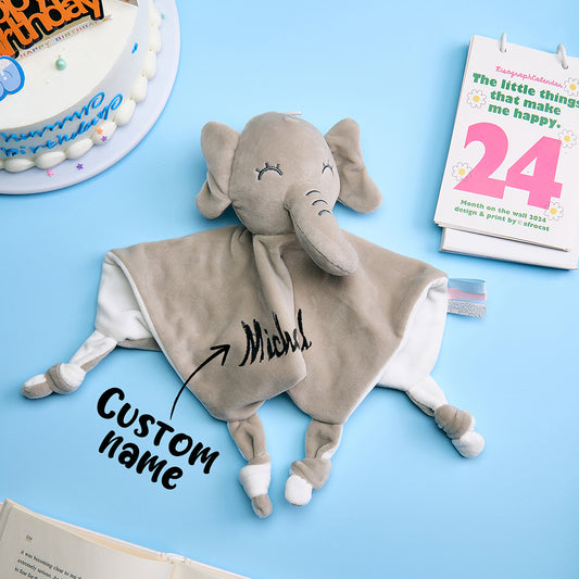 Personalised baby comforter with embroidered name and a soft rabbit head, 25cm square, made from gentle polyester.
