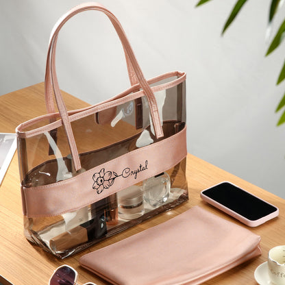 Detail shot of clear PVC material, sturdy handles and zip closure on a personalised tote — wipe-clean and durable for events