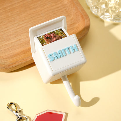 Close-up detail of a 3D printed personalised gravity hook showing crisp photo customisation and smooth eco-friendly PLA finish — bespoke keepsake gift idea