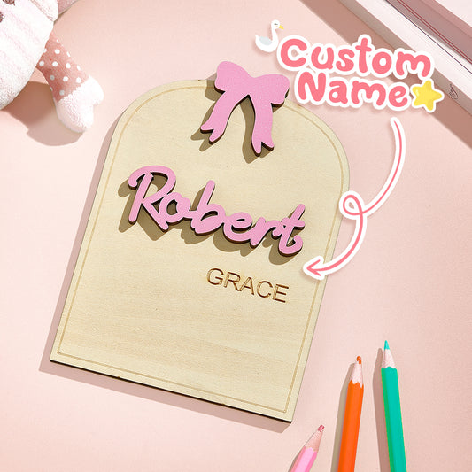 Personalised Baby Name Sign with coquette bow on wooden plaque showing custom birth info for nursery