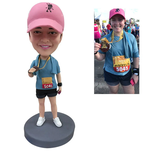 Personalised polymer clay mini‑me bobblehead — custom head sculpted from your photo on an engraved base, front view, ideal personalised gift