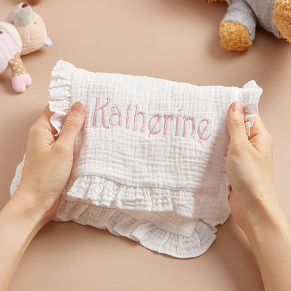 Soft cotton muslin texture and weave detail of the baby towel.
