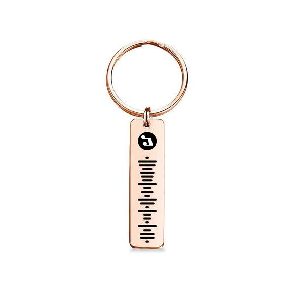 Front and back views of personalised music code metal keychain highlighting engraving and durable finish