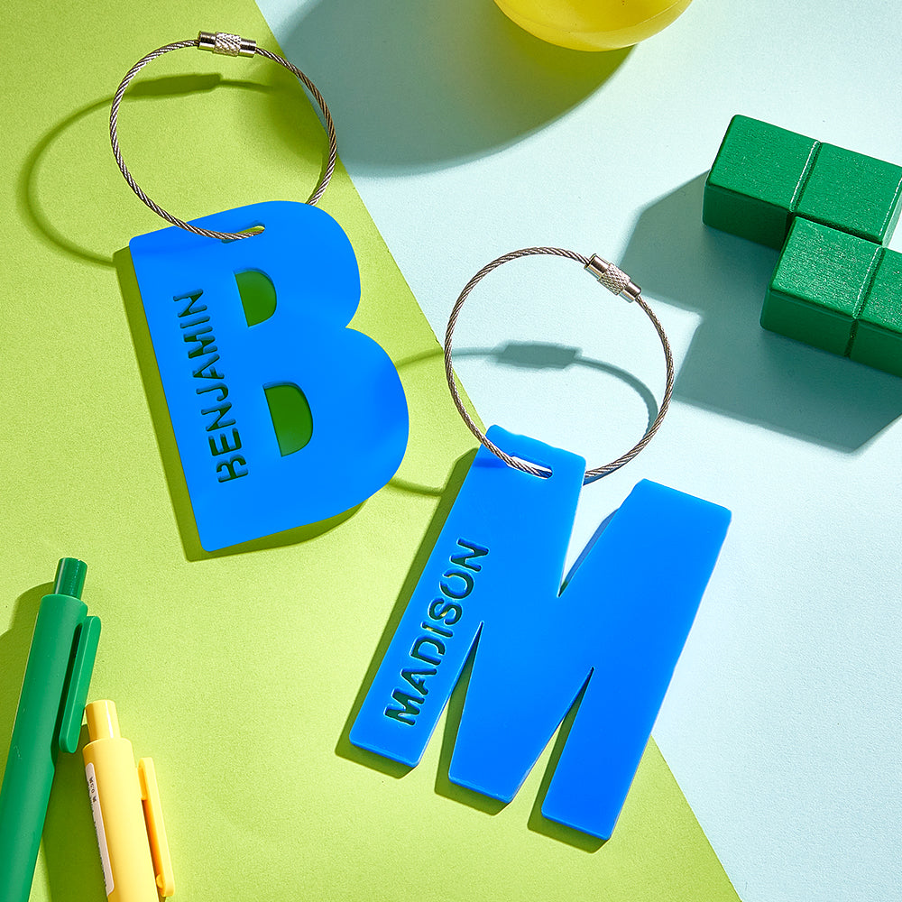 Personalised acrylic backpack tag with bold custom name and colourful design, ideal kids' school name tag and luggage identifier
