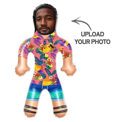 Close-up of personalised inflatable doll showing custom face design on a tropical shirt