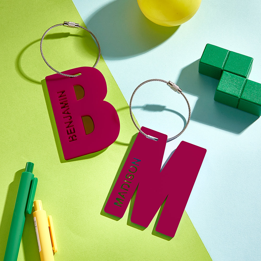 Colourful personalised school name tag for children, acrylic printed design hanging from backpack with prominent custom name