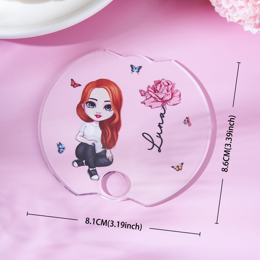 Side profile of acrylic lid topper demonstrating slim fit on a 40oz Stanley tumbler lid, personalised Cartoon Girl name tag and birth flower detail