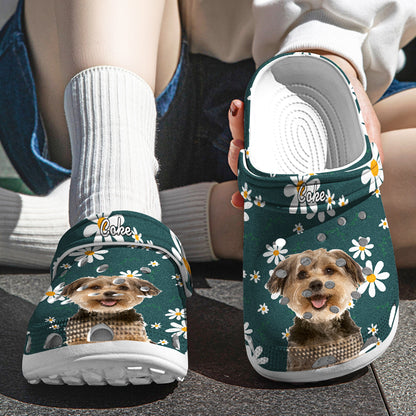 Angled view of personalised pet face clogs showing floral pattern, pet photo on the toe and the custom name on the strap