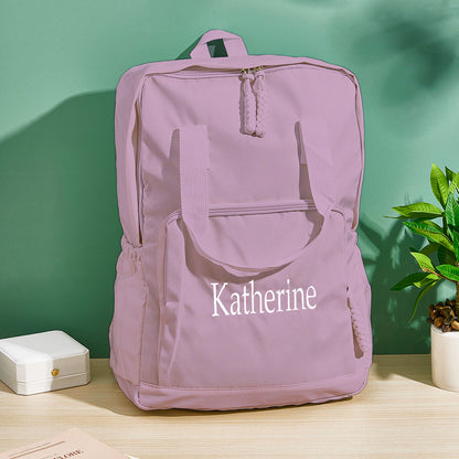 Close-up of personalised name embroidery on nylon fabric, showing fine stitching detail on this custom travel bag gift for friends