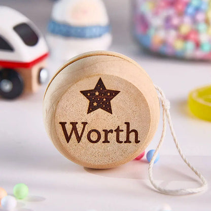 Gift-wrapped personalised wooden yo-yo presented as a thoughtful birthday present and family keepsake