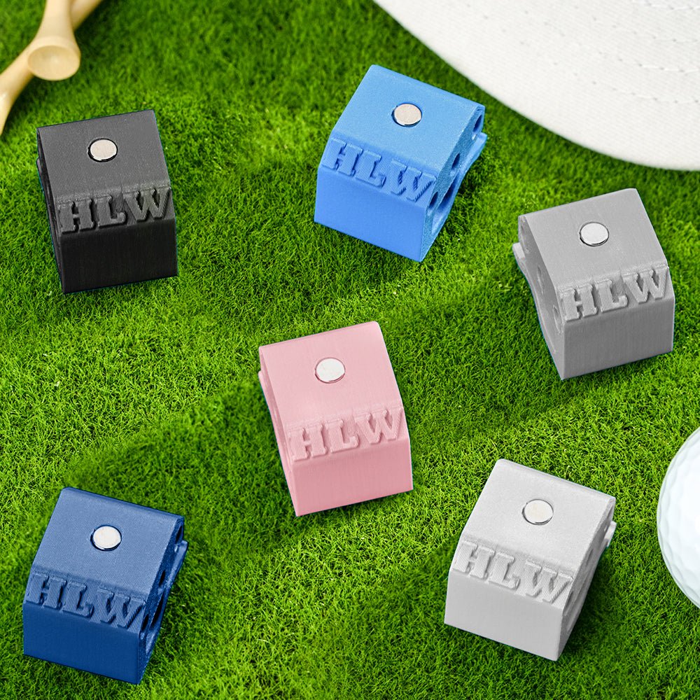 Assorted coloured 3D printed hat clips displaying custom text and symbols — personalised golf accessories for golfers
