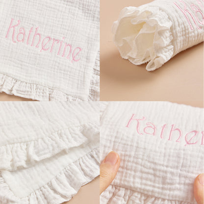Close-up of embroidered name on the baby towel, showcasing precise stitching.