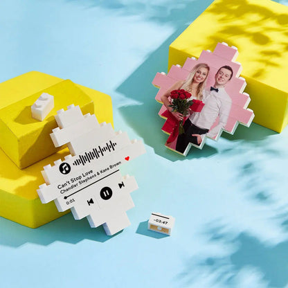 Child arranging personalised lozenge building bricks on the floor — promotes fine motor skills and creative play