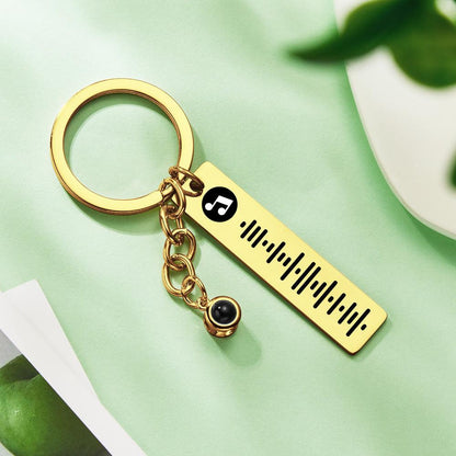 Reverse view showing metal plaque finish and key ring attachment of personalised projection music keychain