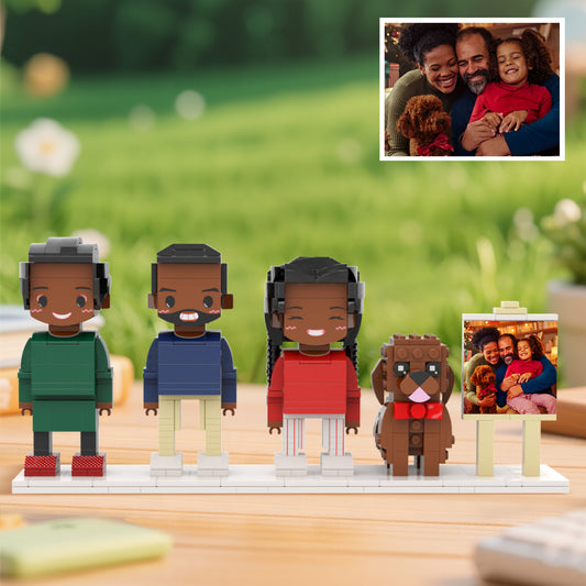 Personalised full‑body brick figures of three people and a dog displayed in a neat frame — custom family keepsake for anniversaries and birthdays
