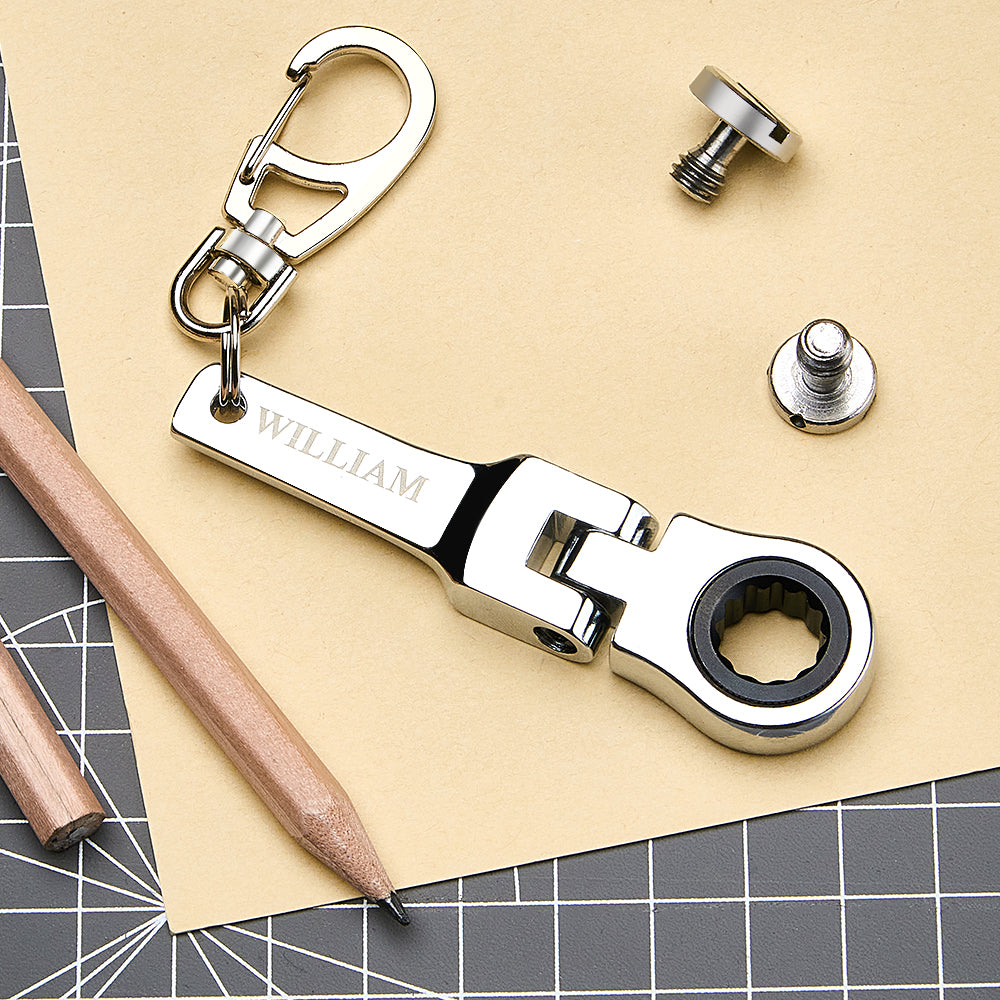 Mini 10mm ratchet wrench keyring shown on keys and bag demonstrating compact 8cm everyday carry, ideal personalised groomsman or Father’s Day gift