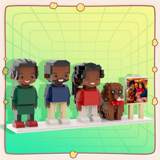 Personalised full‑body brick figures of three people and a dog displayed in a neat frame — custom family keepsake for anniversaries and birthdays