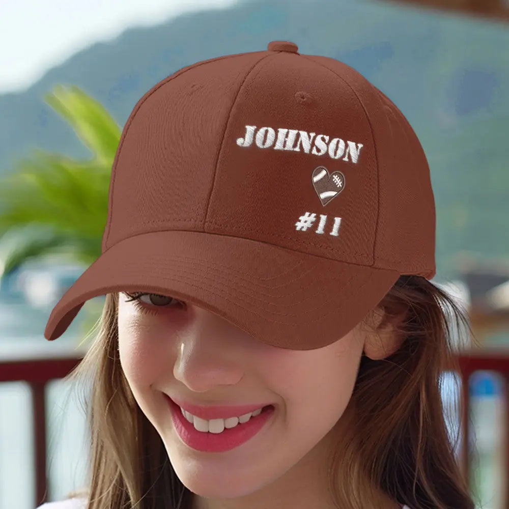 Close-up of personalised football team cap embroidery showing custom name detail on a polyester baseball hat for teammates and fans