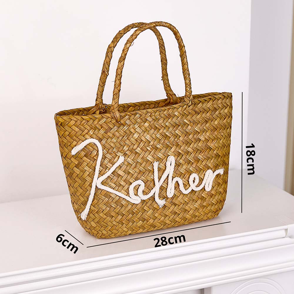 Top view of personalised handmade straw bucket bag showing roomy interior and practical opening perfect for travel
