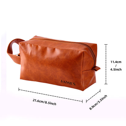 Personalised men's travel pouch with shaving essentials displayed — spacious PU leather travel wash bag, ideal as a personalised gift.