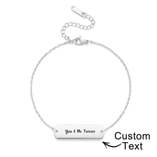 Close-up of personalised photo bracelet in silver stainless steel showing an engraved custom portrait pendant on a 22+6cm chain – personalised jewellery gift for her