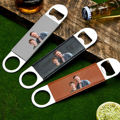 Close-up view of the personalised photo bottle opener showing the PU leather handle and metal opener.