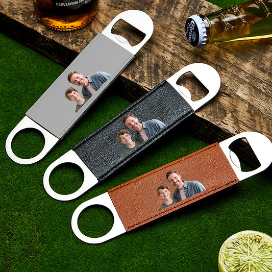 Close-up view of the personalised photo bottle opener showing the PU leather handle and metal opener.